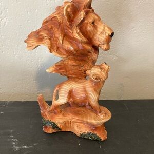 Resin lion with child